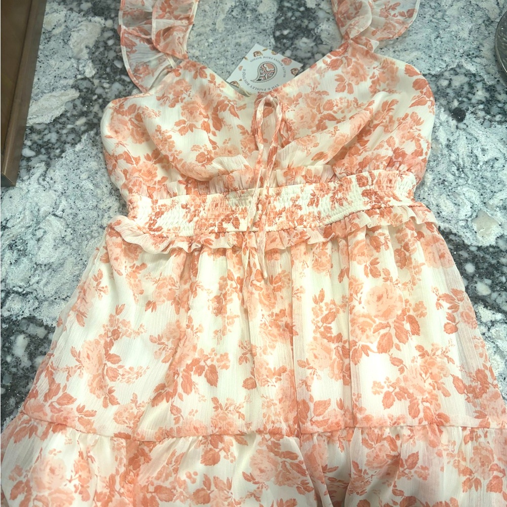 Beautiful feminine ruffle sheer floral romper